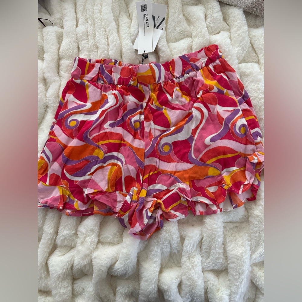 Groovy, pink patterned ruffle shorts with pockets